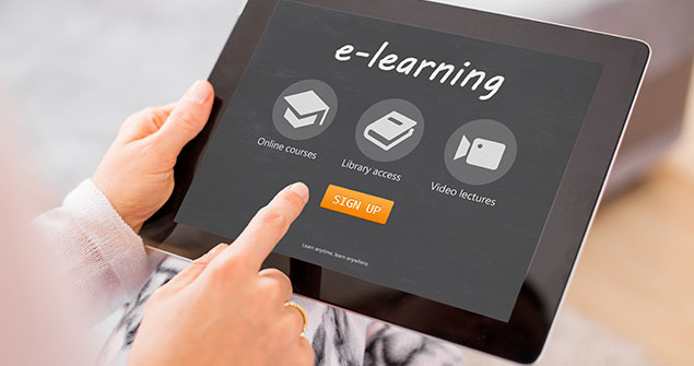 A person holding an e-learning tablet