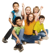 A group of six elementary school students sitting together smiling